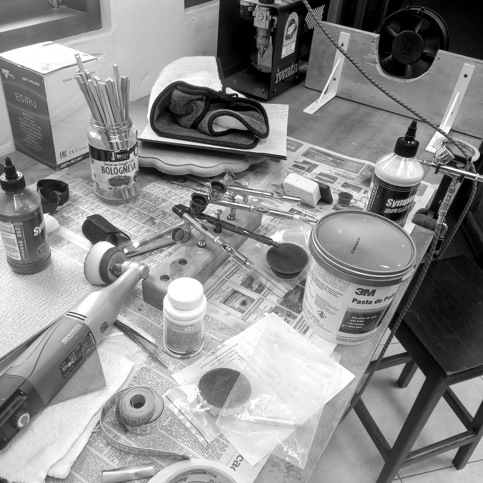 Workshop desk with airbrushes and materials